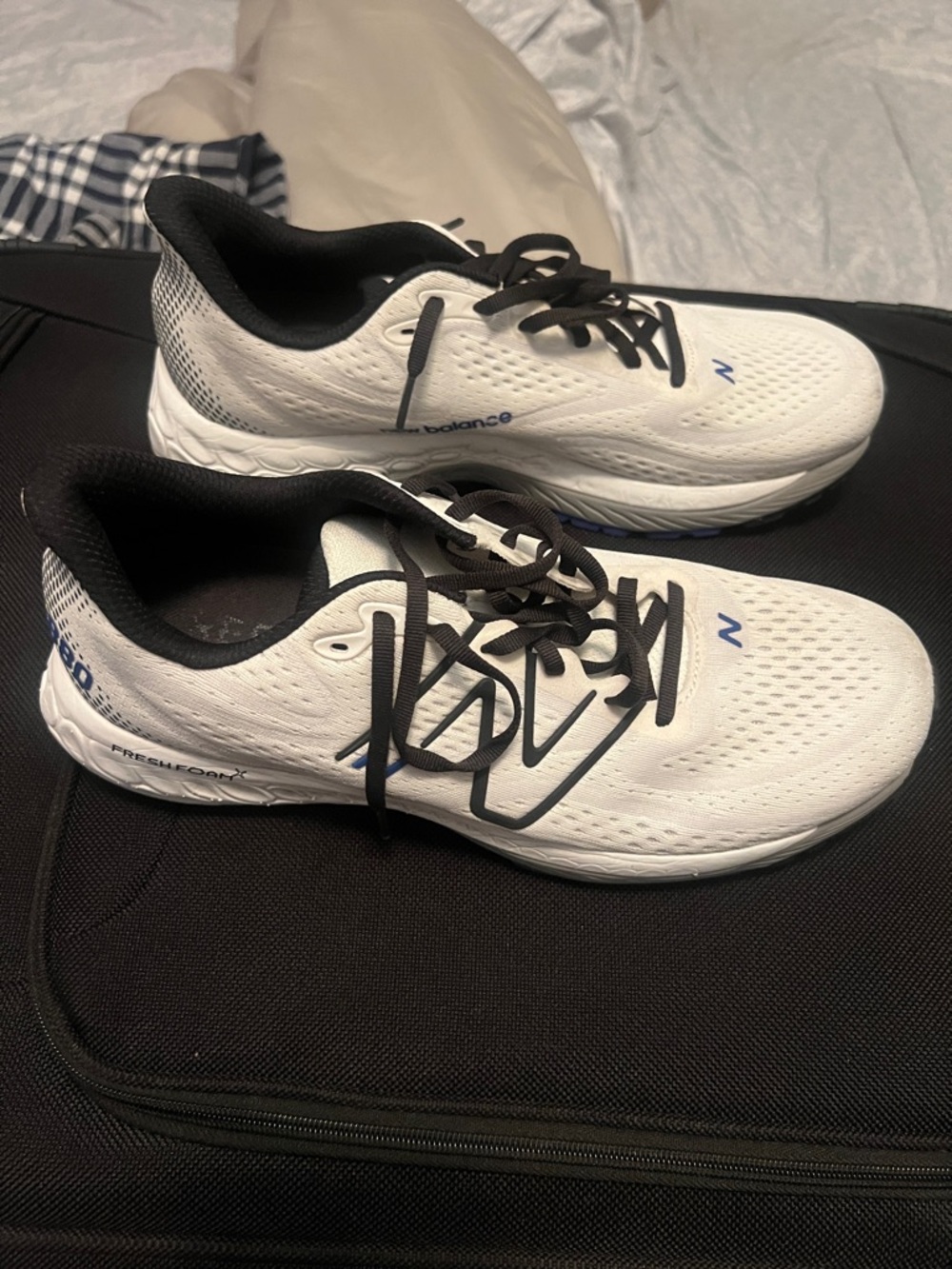 New Balance White and Black Running Shoes with Blue Accents